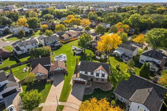 an aerial view of residential houses with outdoor space
