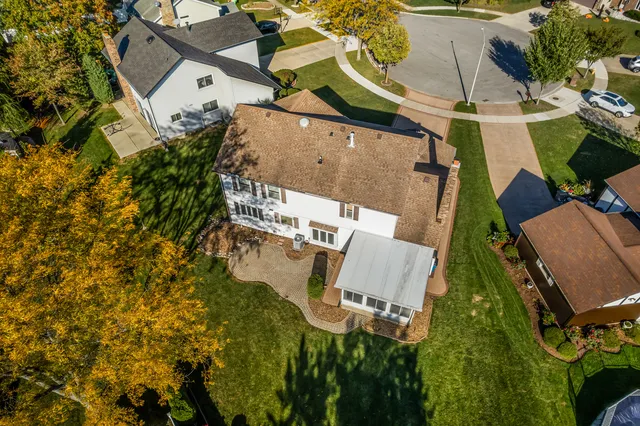 an aerial view of residential house with outdoor space and parking