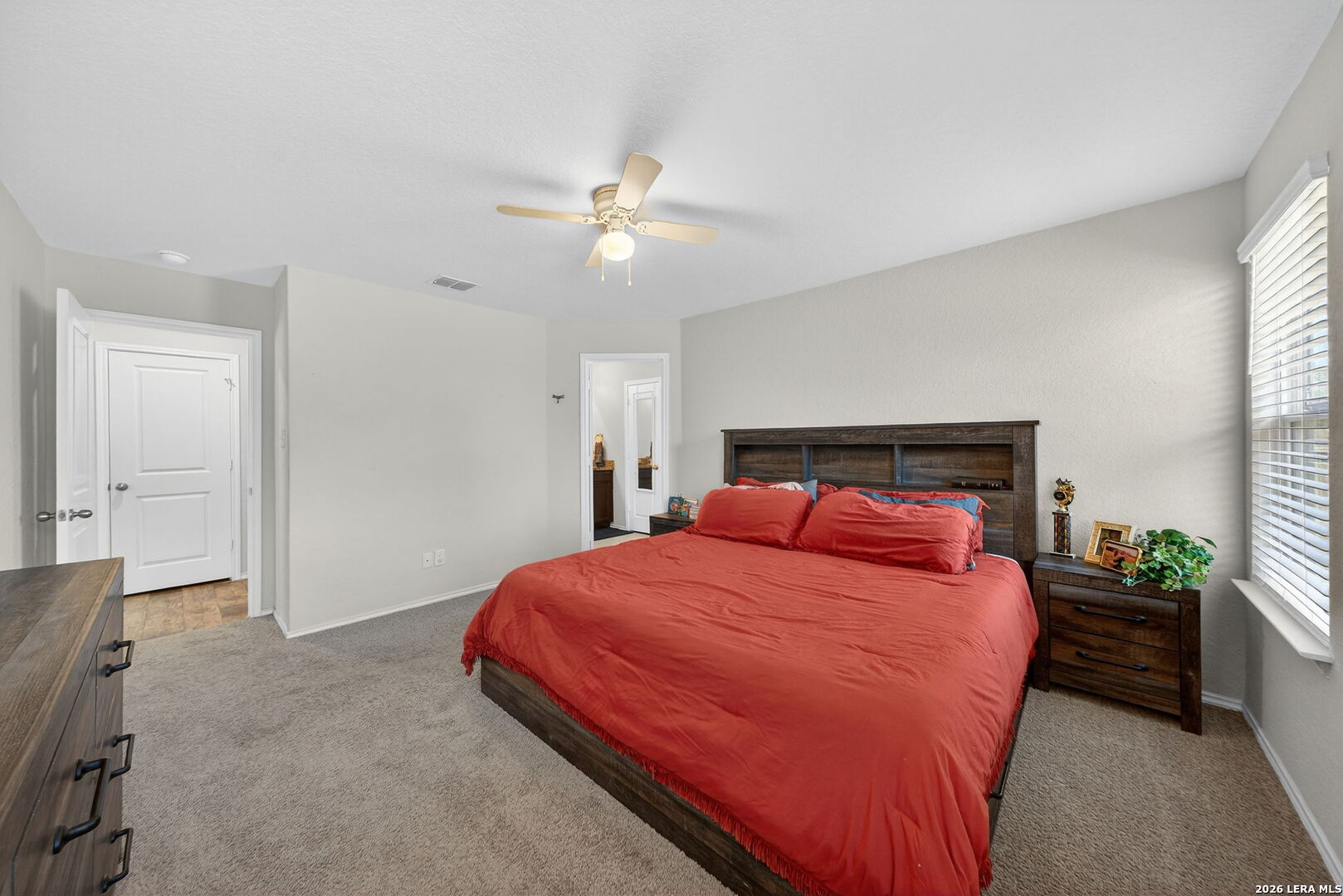 3653 Copper River Bulverde, TX 78163 - Photo 11 of 25 a bedroom with a bed and a chandelier