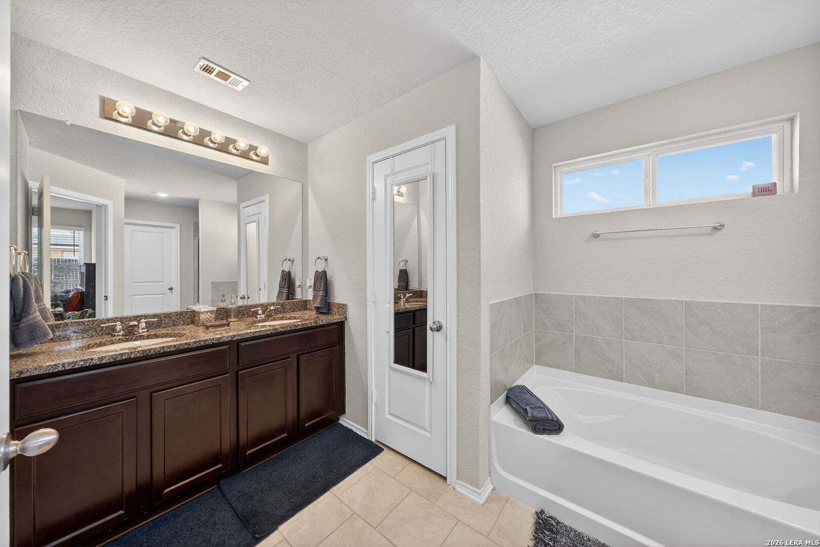 3653 Copper River Bulverde, TX 78163 - Photo 12 of 25 a spacious bathroom with a tub shower and sink
