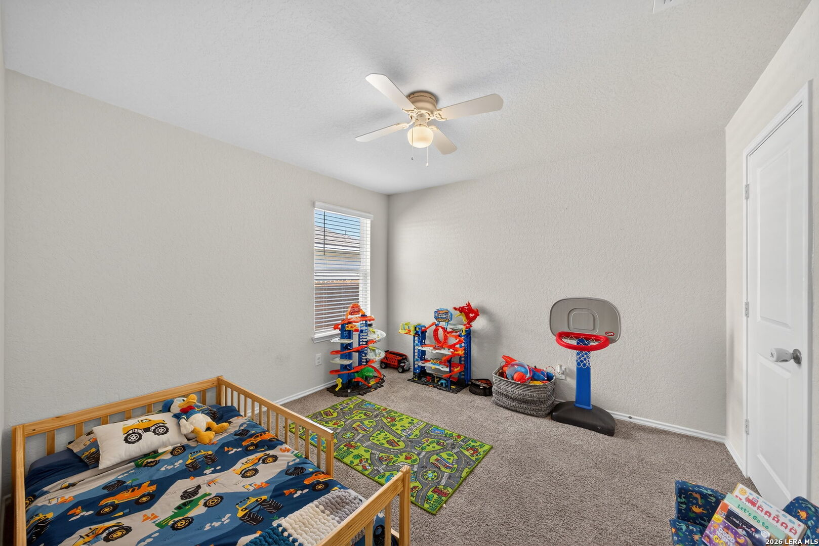 3653 Copper River Bulverde, TX 78163 - Photo 14 of 25 a bedroom with furniture and a baby crib