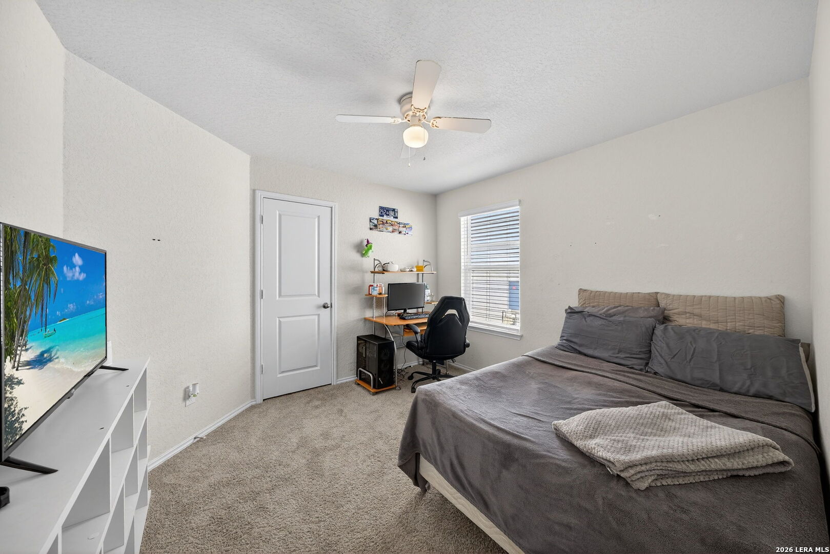 3653 Copper River Bulverde, TX 78163 - Photo 15 of 25 a bedroom with a bed and a chandelier