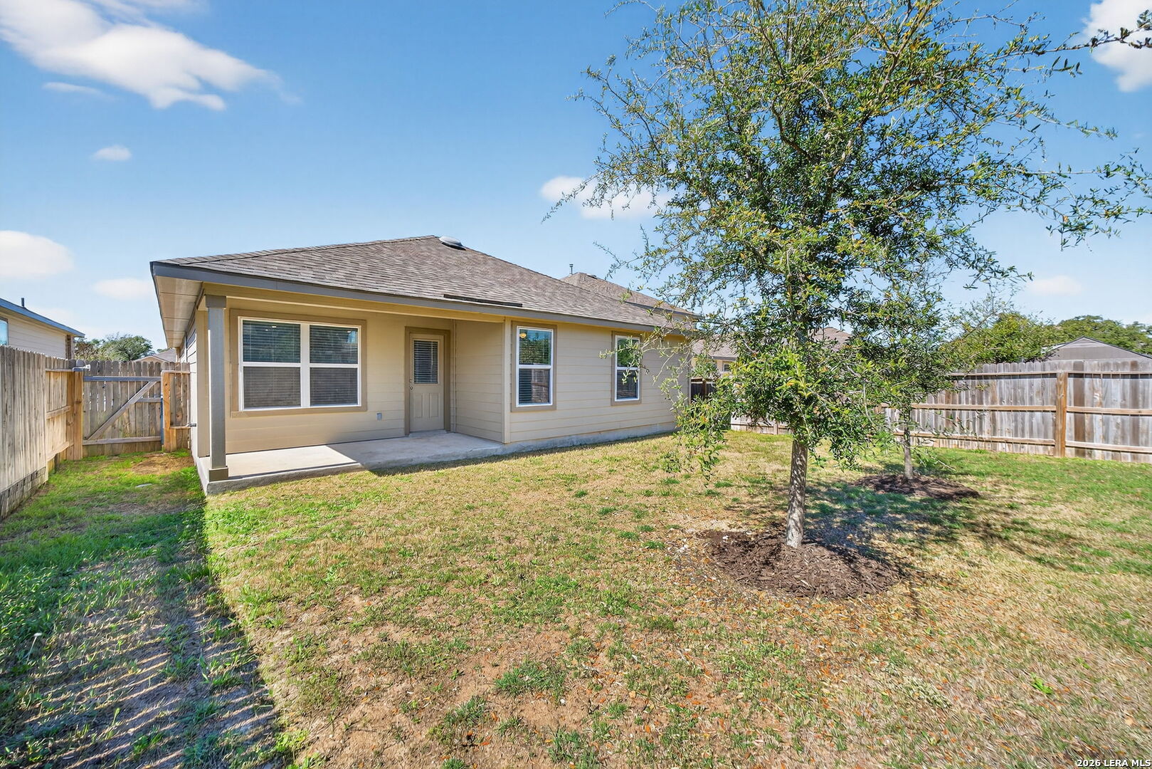 3653 Copper River Bulverde, TX 78163 - Photo 20 of 25 a backyard of a house with plants and large trees