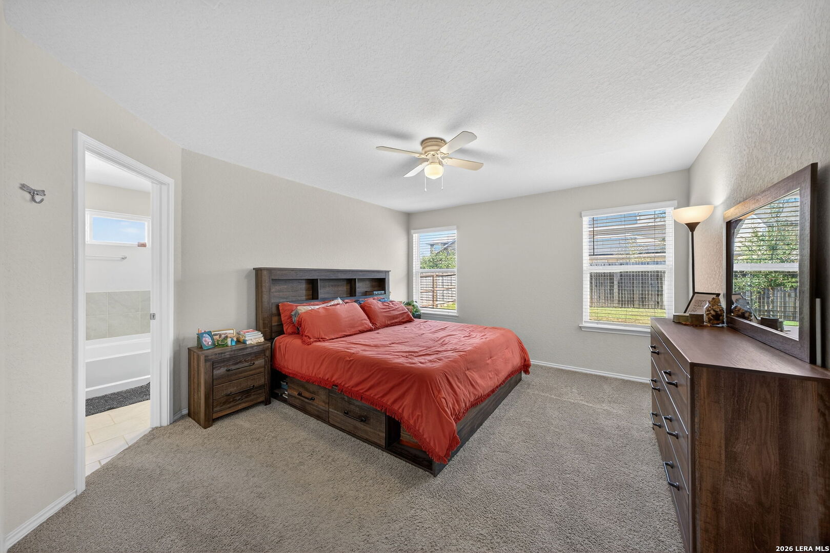 3653 Copper River Bulverde, TX 78163 - Photo 10 of 25 a bedroom with a bed and a table with window