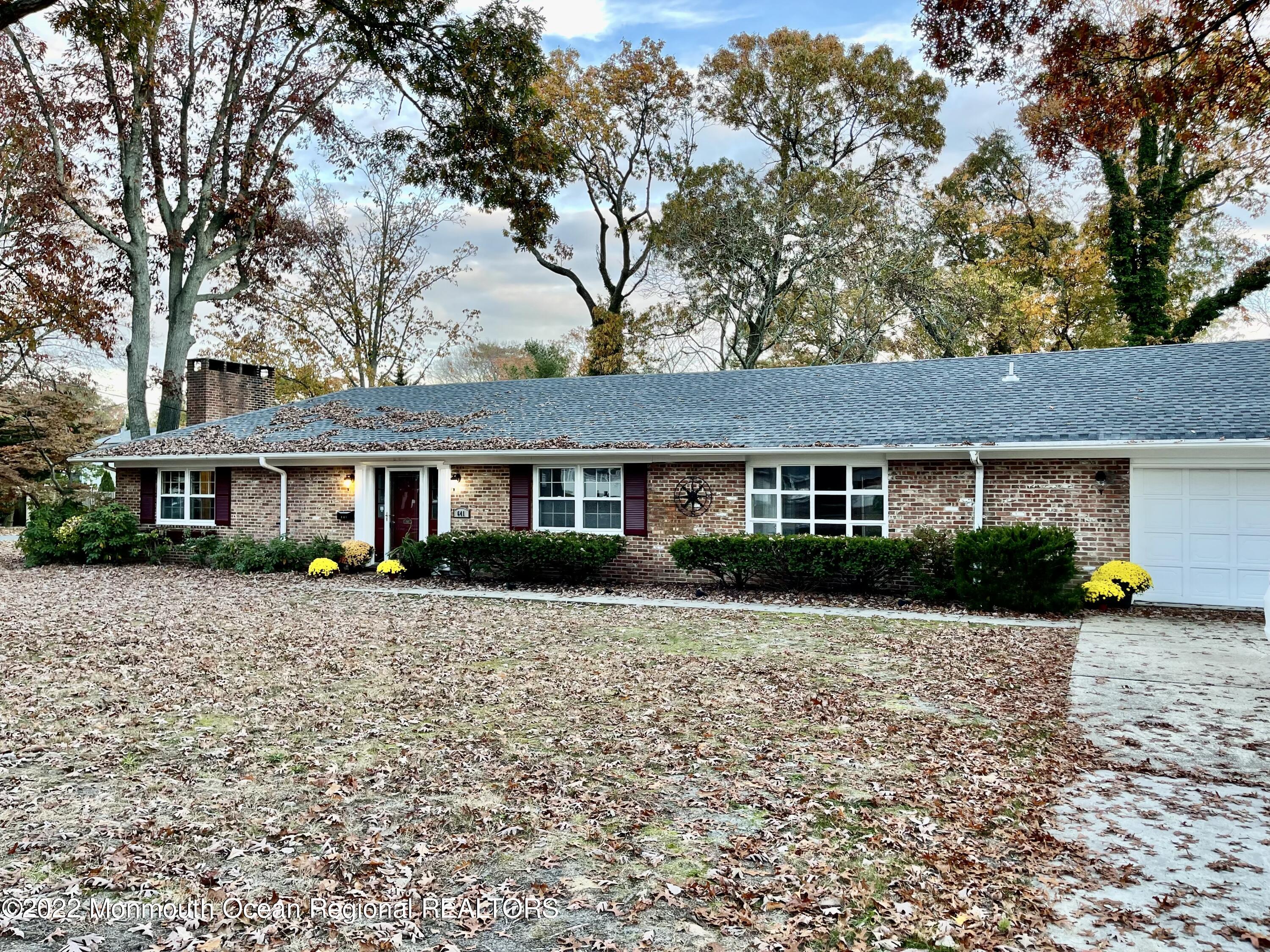 641 Thoroughfare Road Brick, NJ 08724 - Photo 30 of 48 a front view of a house with a yard