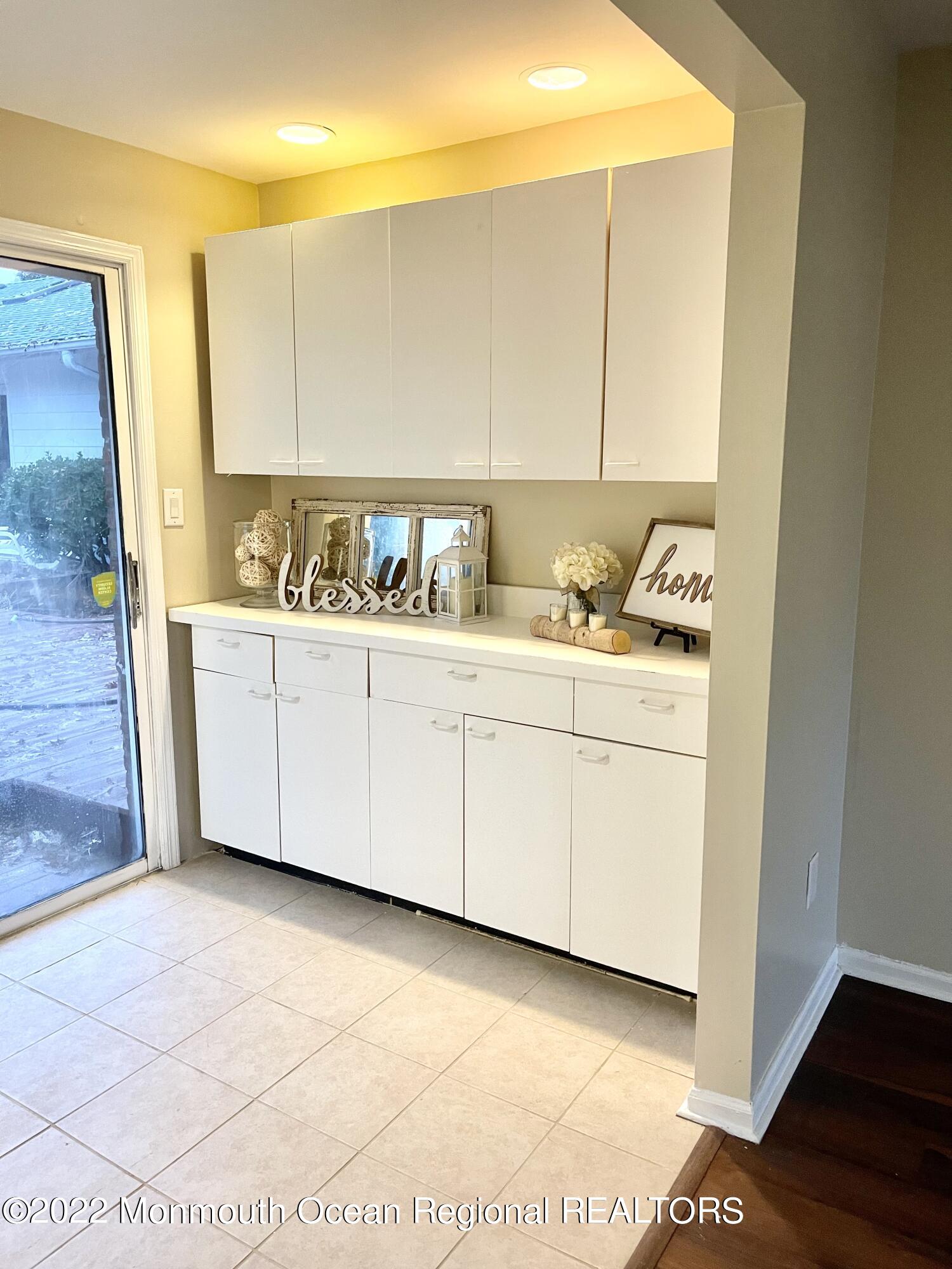641 Thoroughfare Road Brick, NJ 08724 - Photo 31 of 48 a view of cabinets a sink and a stove in a room