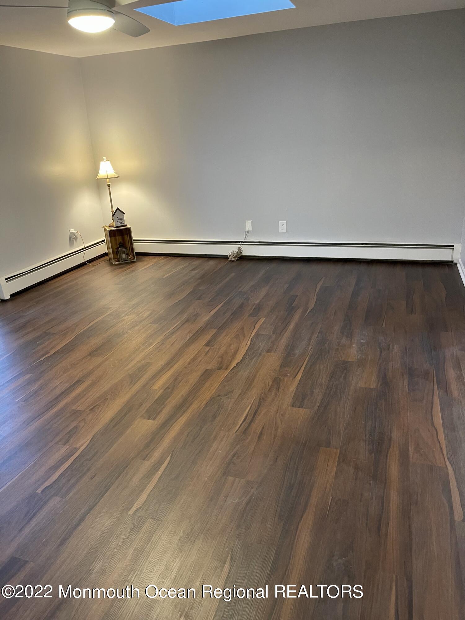 641 Thoroughfare Road Brick, NJ 08724 - Photo 42 of 48 a view of empty room with wooden floor