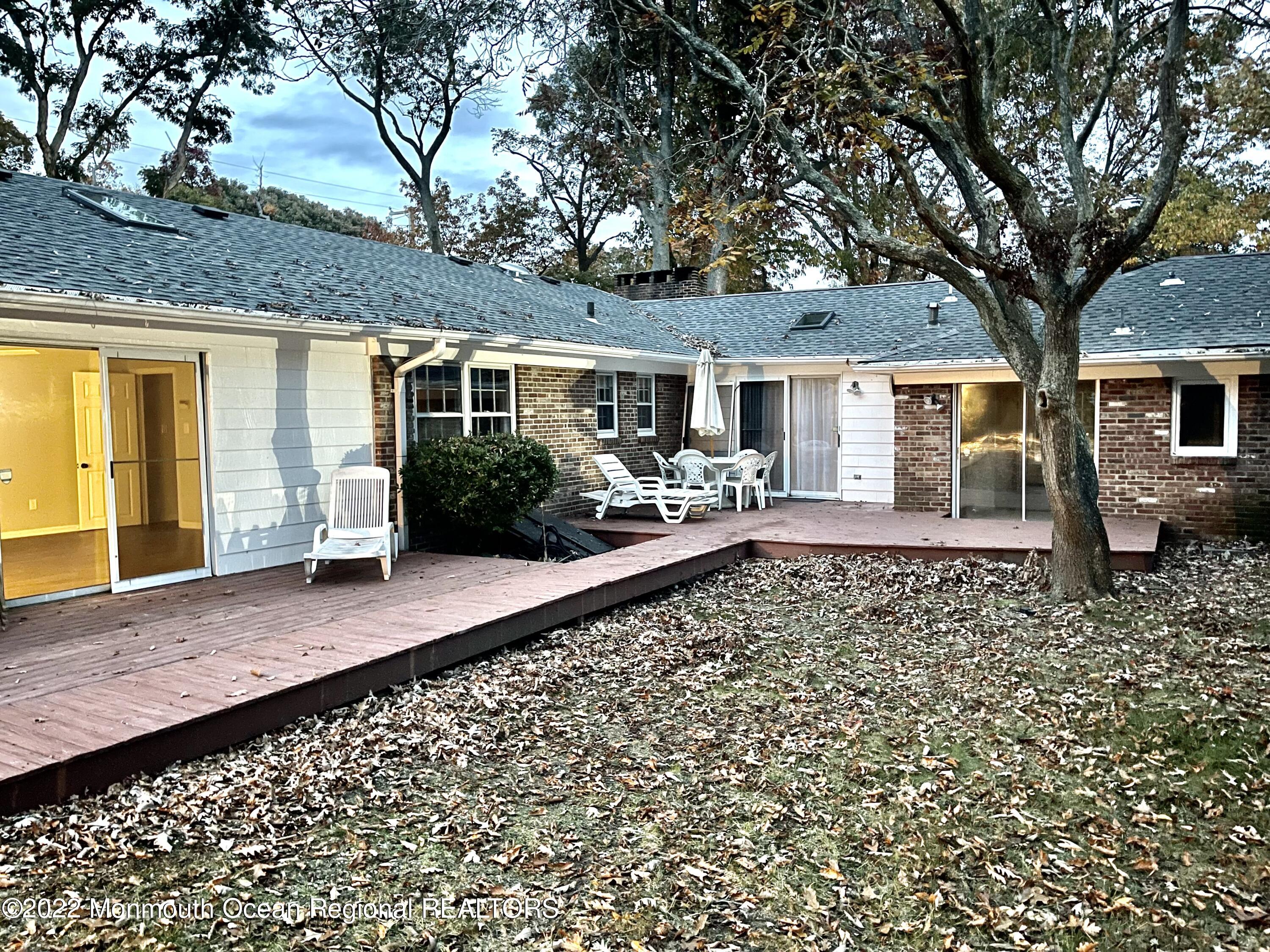 641 Thoroughfare Road Brick, NJ 08724 - Photo 44 of 48 front view of a house with a large tree