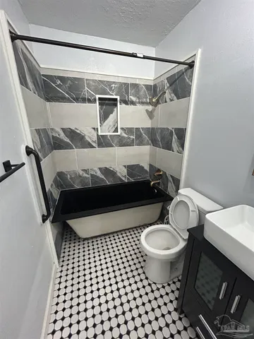 a bathroom with a sink and a toilet