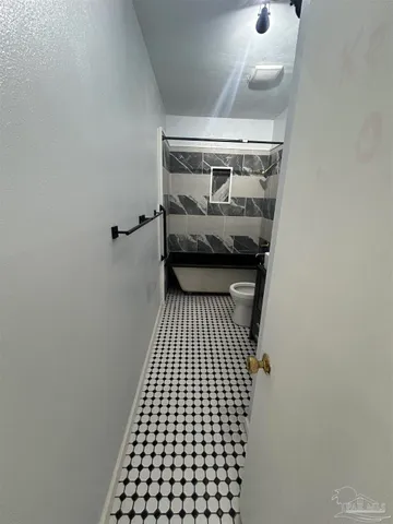 a view of balcony with wooden floor