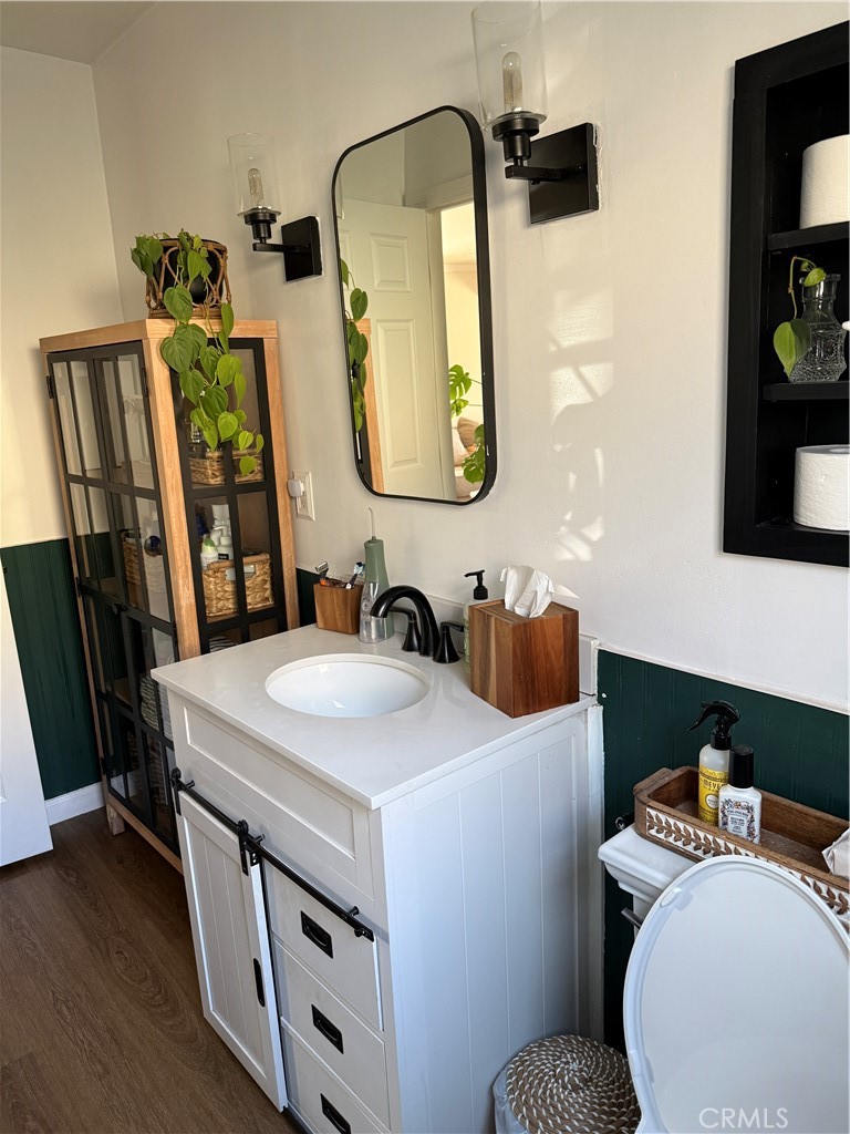 3359 Locust Street Riverside, CA 92501 - Photo 20 of 23 a bathroom with a sink and a mirror
