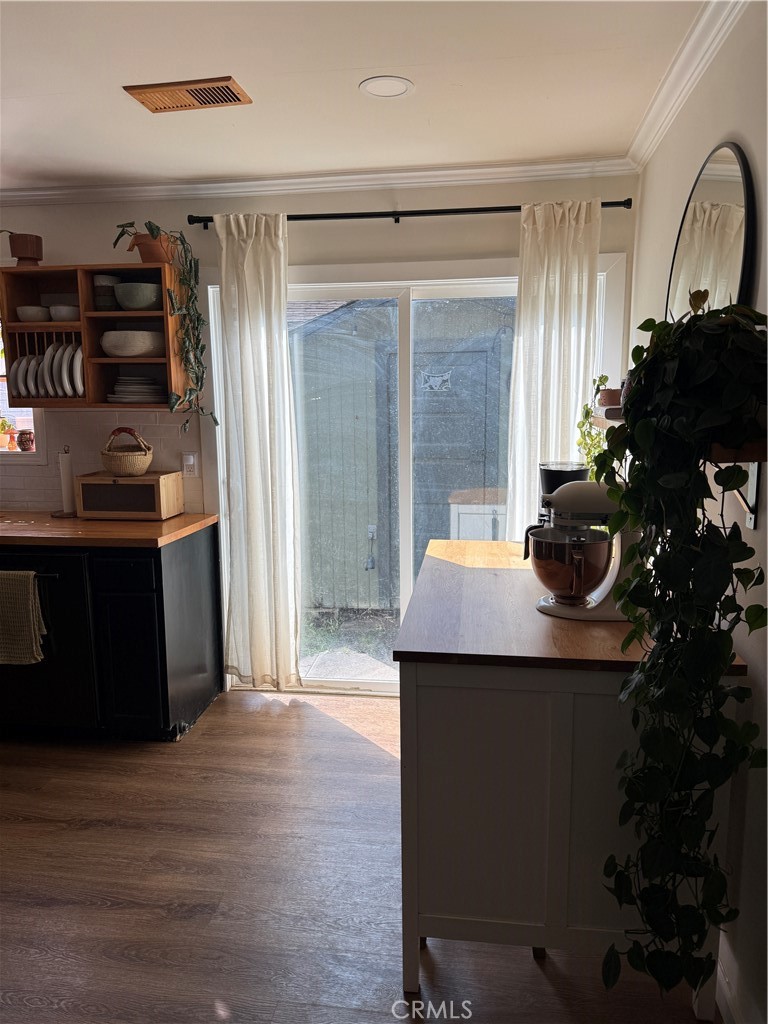 3359 Locust Street Riverside, CA 92501 - Photo 4 of 23 a kitchen with stainless steel appliances granite countertop a sink and a refrigerator