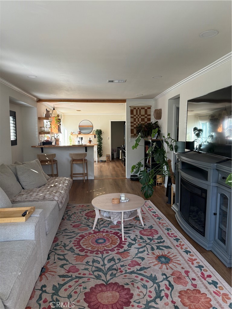 3359 Locust Street Riverside, CA 92501 - Photo 6 of 23 a living room with furniture and a fireplace