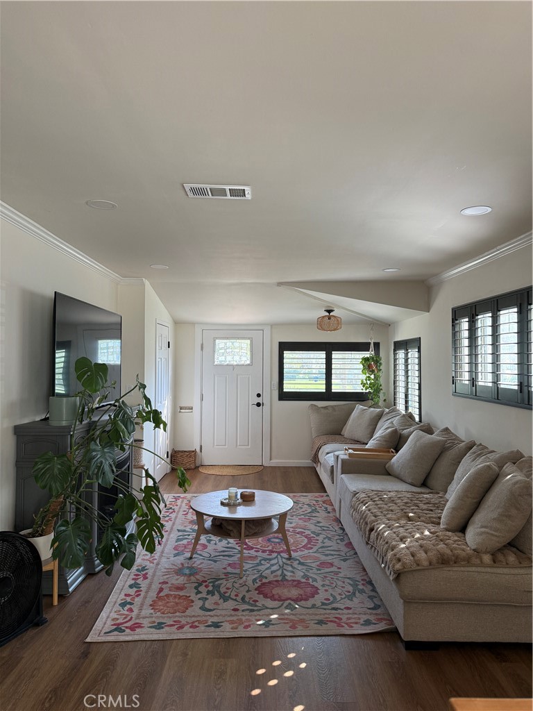 3359 Locust Street Riverside, CA 92501 - Photo 7 of 23 a living room with furniture a rug and a window