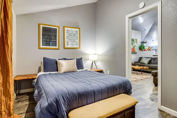 a bedroom with a bed and a window
