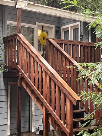 a view of an house with staircase and wooden floor