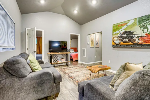 a living room with furniture and a large window