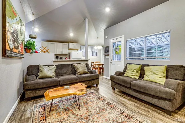 a kitchen with a sink refrigerator and cabinets