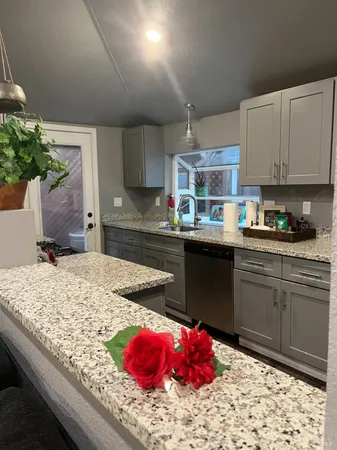 a kitchen with a sink and cabinets