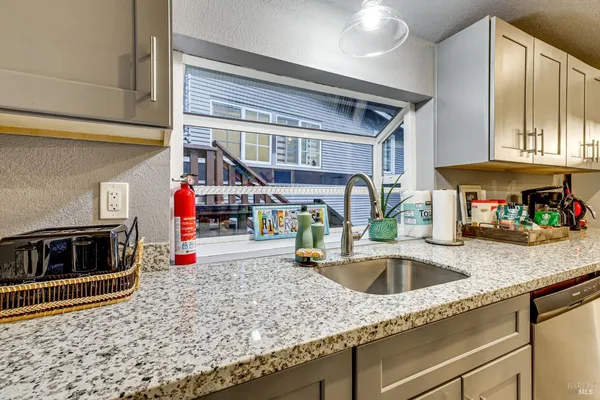 a kitchen with a table and chairs in it