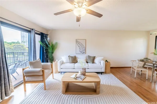a living room with furniture and a large window