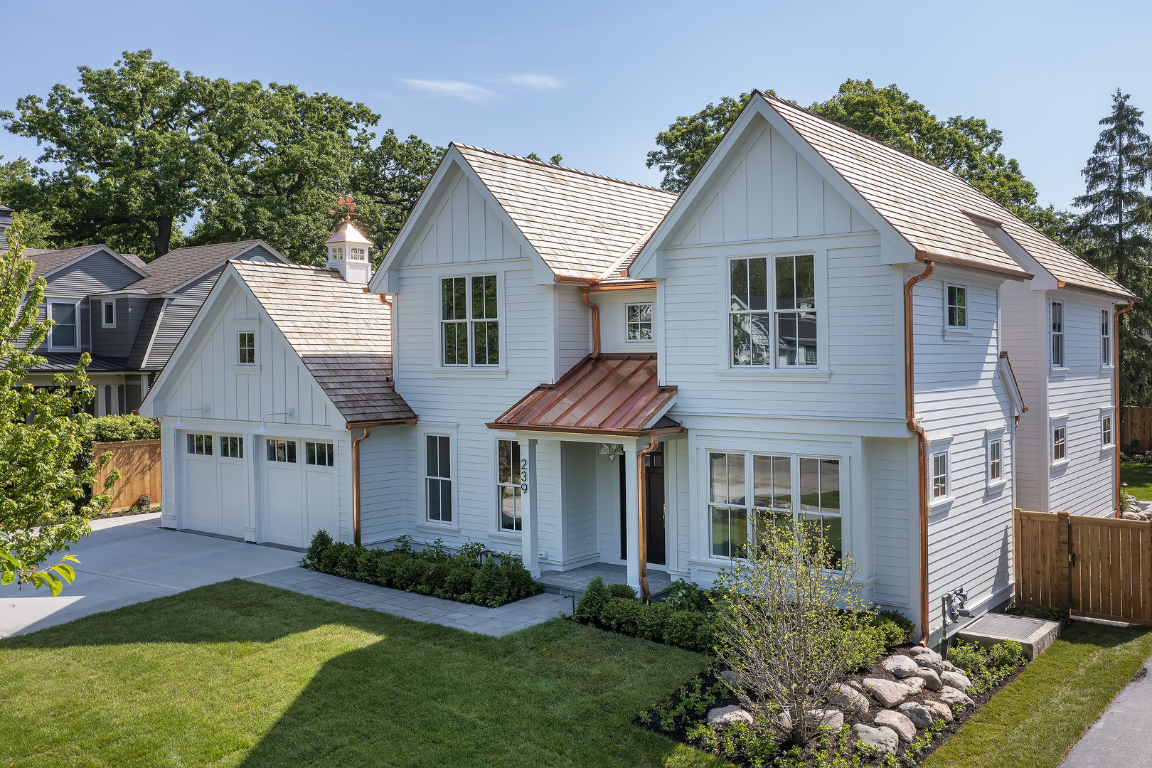239 Ridge Avenue Winnetka, IL 60093 - Photo 2 of 14 a front view of a house with a yard