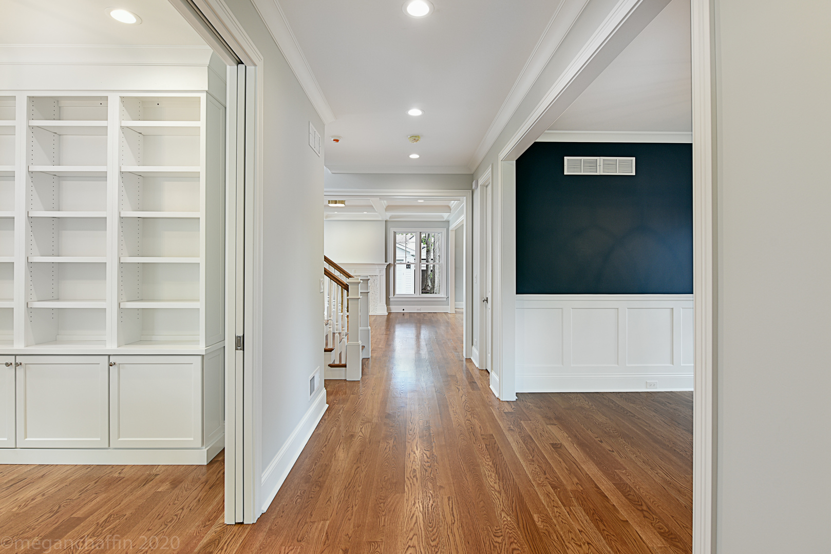 239 Ridge Avenue Winnetka, IL 60093 - Photo 3 of 14 a view of a hallway with wooden floor and cabinet