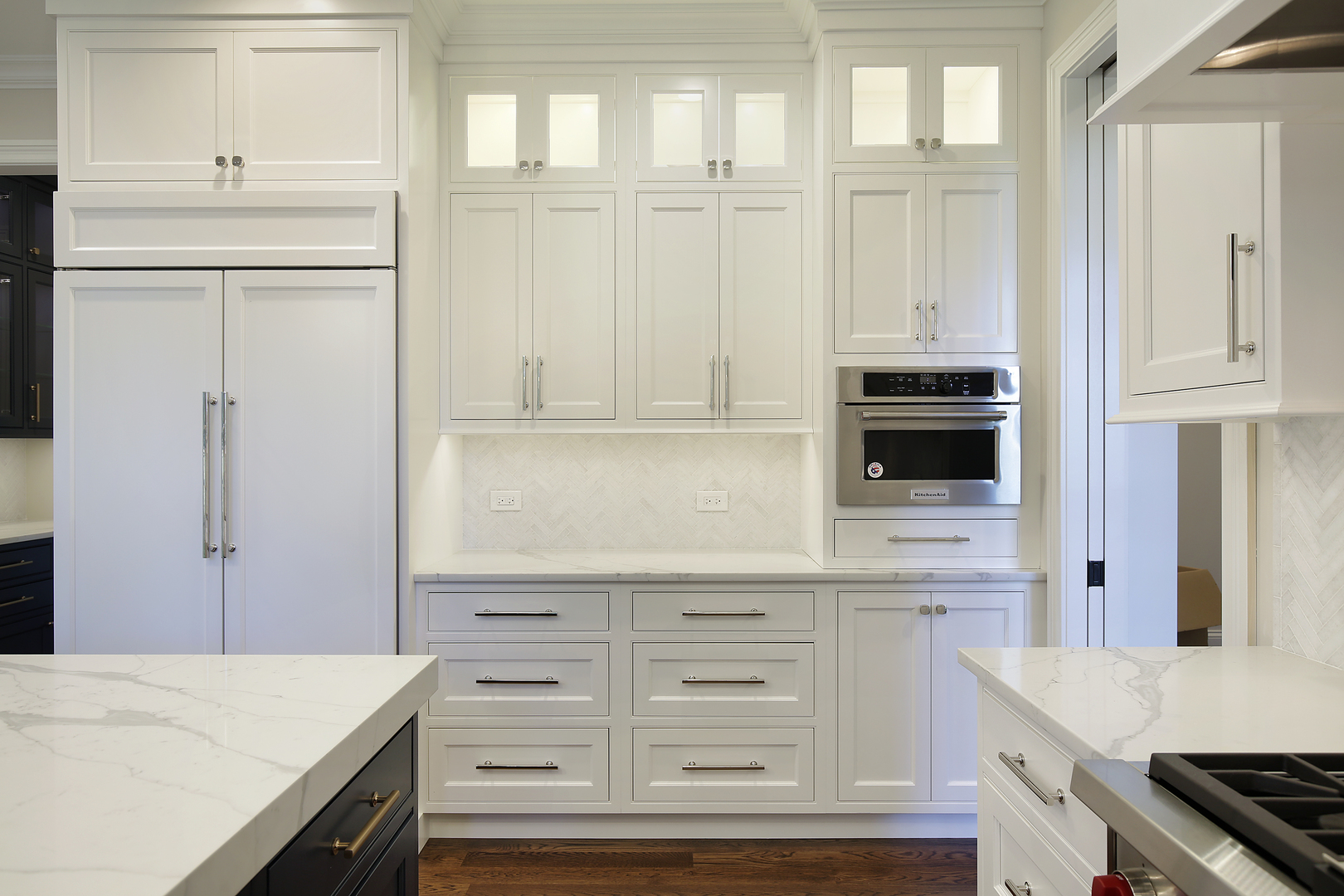 239 Ridge Avenue Winnetka, IL 60093 - Photo 7 of 14 a kitchen with white cabinets and appliances