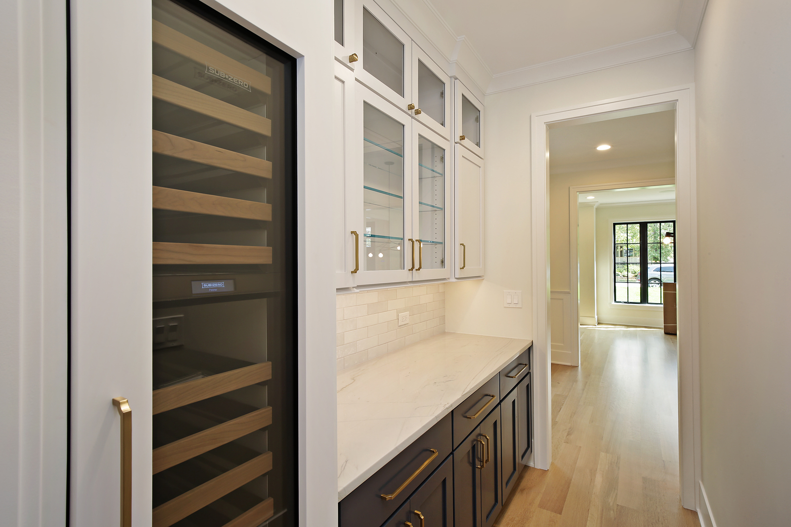 239 Ridge Avenue Winnetka, IL 60093 - Photo 8 of 14 a kitchen with cabinets and wooden floor