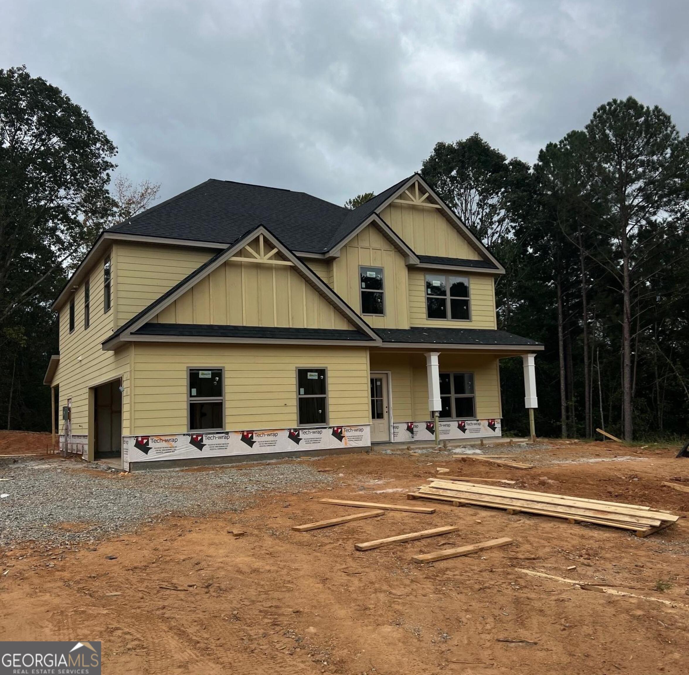 42 Collins Road Locust Grove, GA 30248 - Photo 1 of 1 a front view of a house with a yard