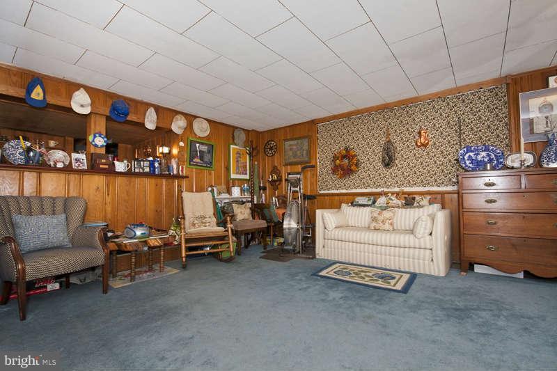 198 Stanmore Road Baltimore, MD 21212 - Photo 11 of 24 a living room with furniture and a baby crib