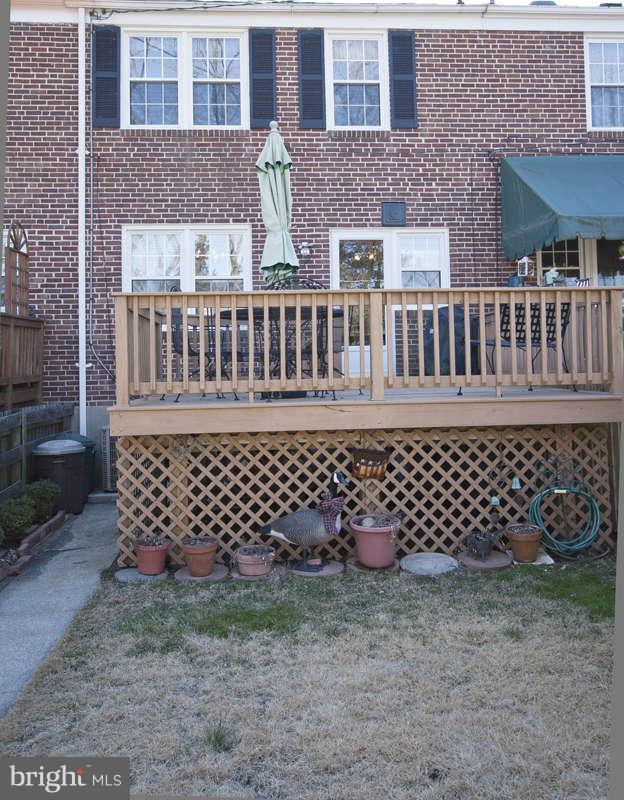 198 Stanmore Road Baltimore, MD 21212 - Photo 22 of 24 front view of a house with a large gate