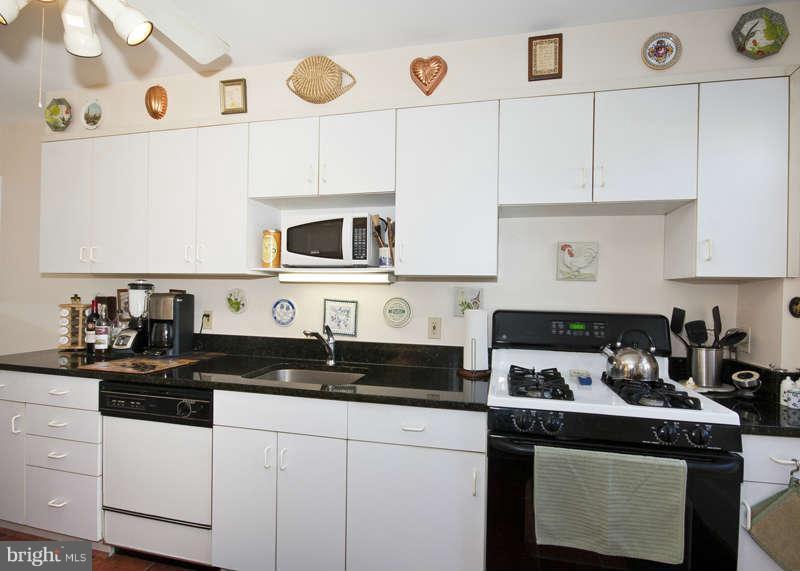 198 Stanmore Road Baltimore, MD 21212 - Photo 10 of 24 a kitchen with cabinets appliances and a sink
