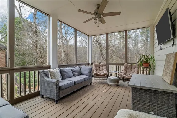 a kitchen with stainless steel appliances granite countertop a refrigerator a stove top oven a sink dishwasher a dining table and chairs with wooden floor