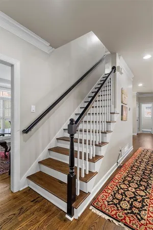 a kitchen with a sink a window and cabinets