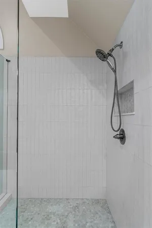 a view of a patio with table and chairs potted plants and large tree