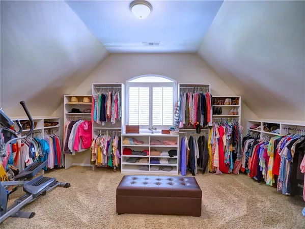 a view of a chair and table in the backyard