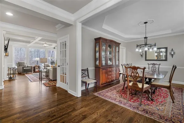 a living room with furniture ceiling fan and a rug