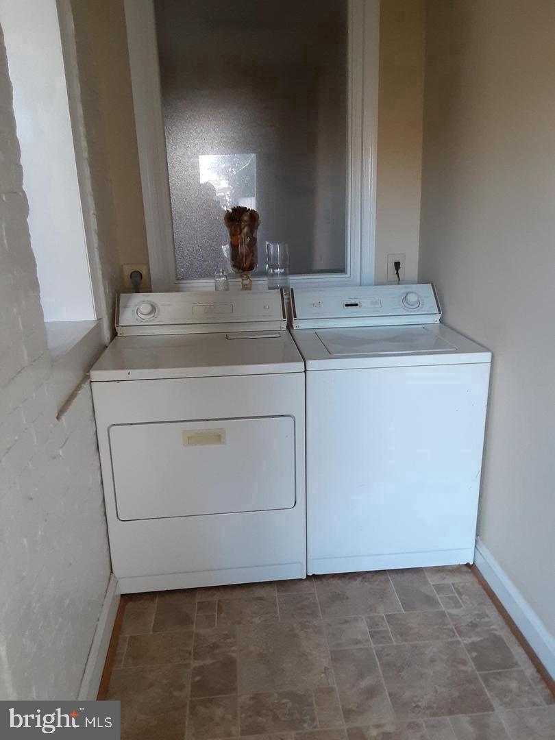 313 North Kent Street Winchester, VA 22601 - Photo 13 of 15 a bathroom with a sink and a mirror