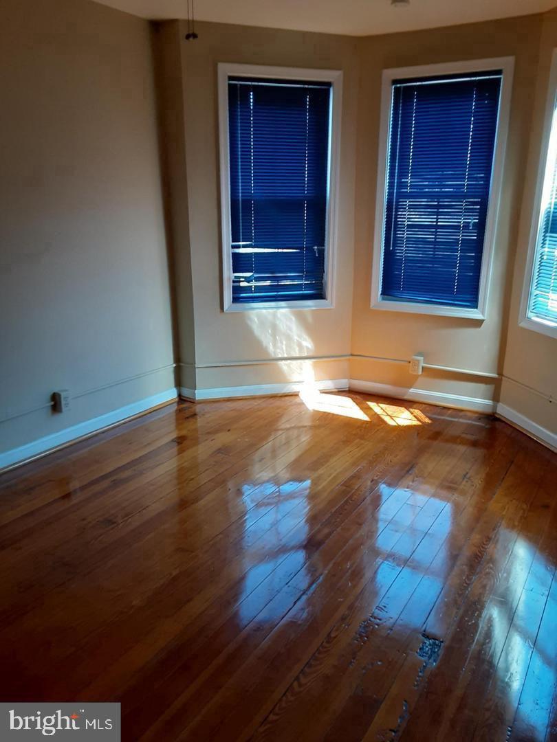 313 North Kent Street Winchester, VA 22601 - Photo 3 of 15 a view of empty room with wooden floor and fan