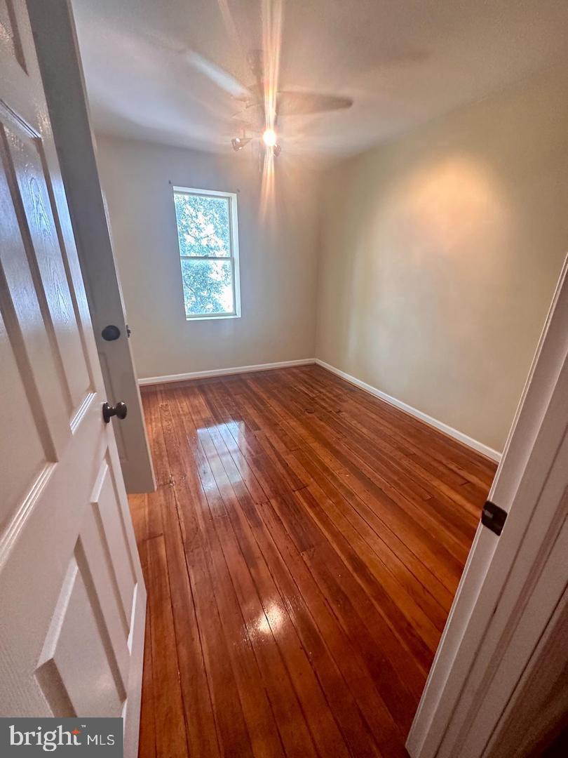 313 North Kent Street Winchester, VA 22601 - Photo 9 of 15 a view of an empty room with wooden floor and a window
