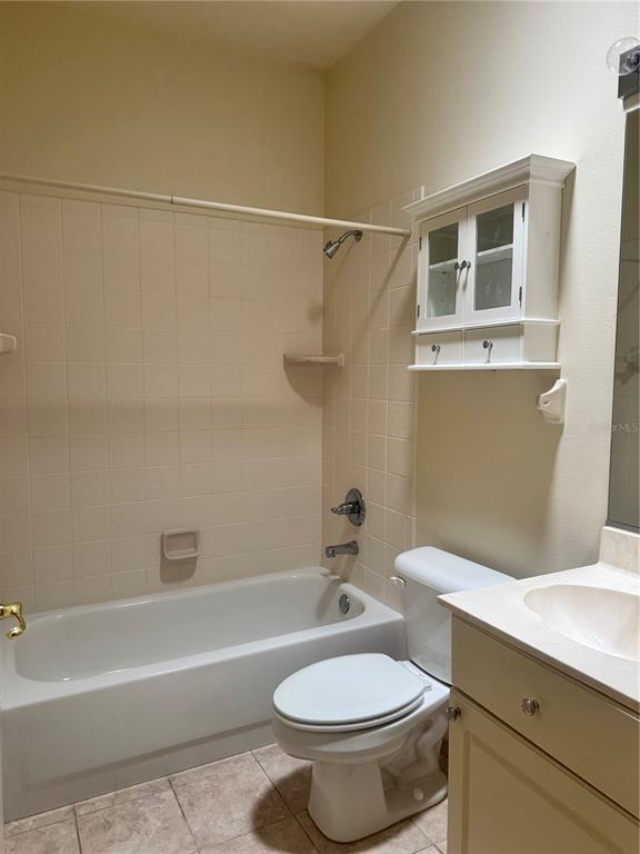 11145 Northwest 17th Court Road Ocala, FL 34475 - Photo 41 of 59 a white toilet sitting next to a bath tub and a shower