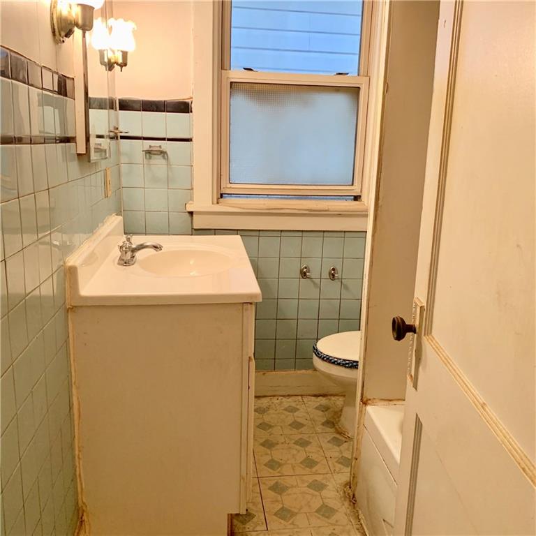 1221 McNeilly Road Pittsburgh, PA 15226 - Photo 14 of 24 Needs a new window, toilet and maybe a smaller vanity.