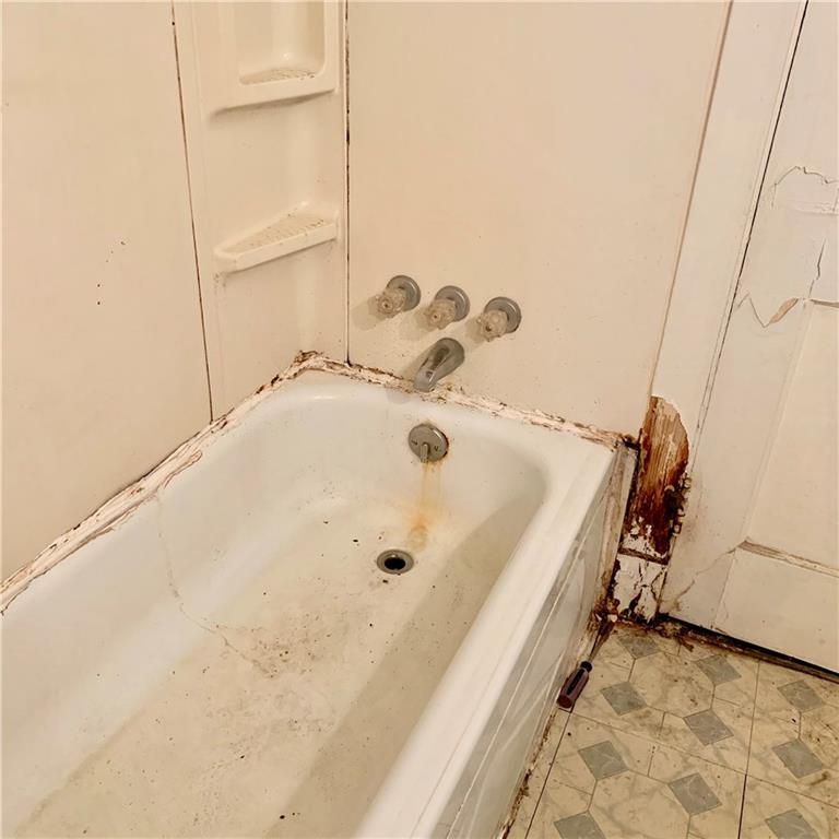 1221 McNeilly Road Pittsburgh, PA 15226 - Photo 5 of 24 Bathroom needs new caulking, paint or replace tub, paint, flooring and some plumbing work.