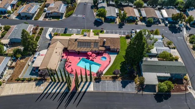 an aerial view of houses with outdoor space