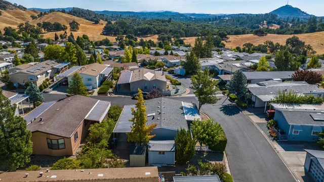an aerial view of residential houses with outdoor space