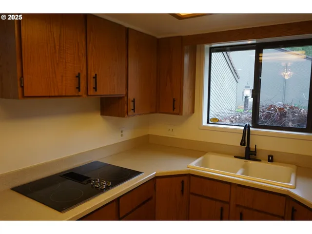 a kitchen with a sink and cabinets