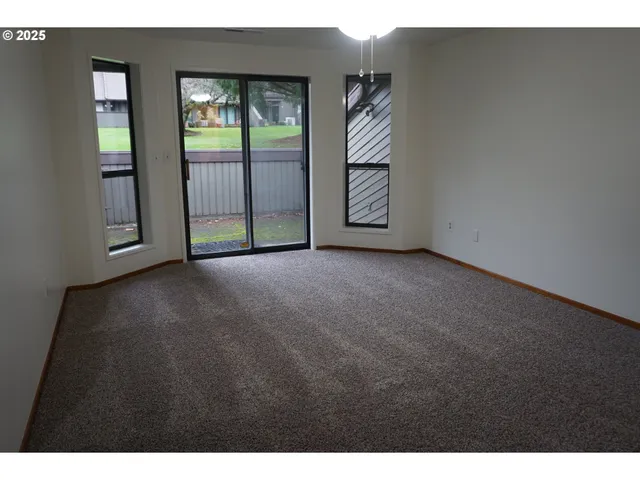 a view of empty room with windows