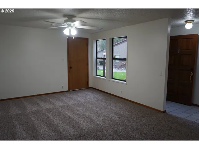 a view of an empty room with a window