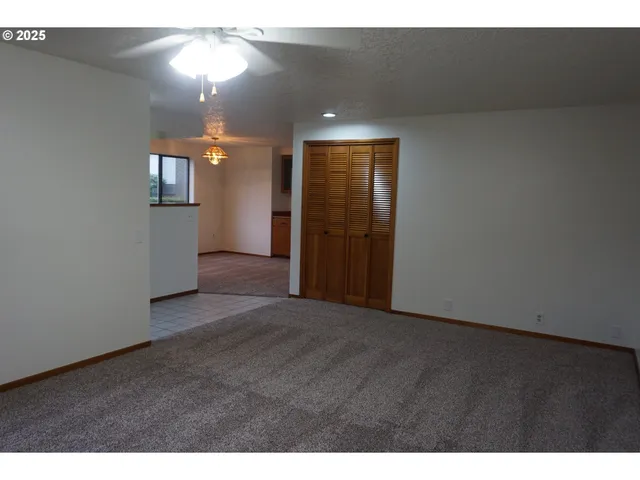 a view of a hallway with a room